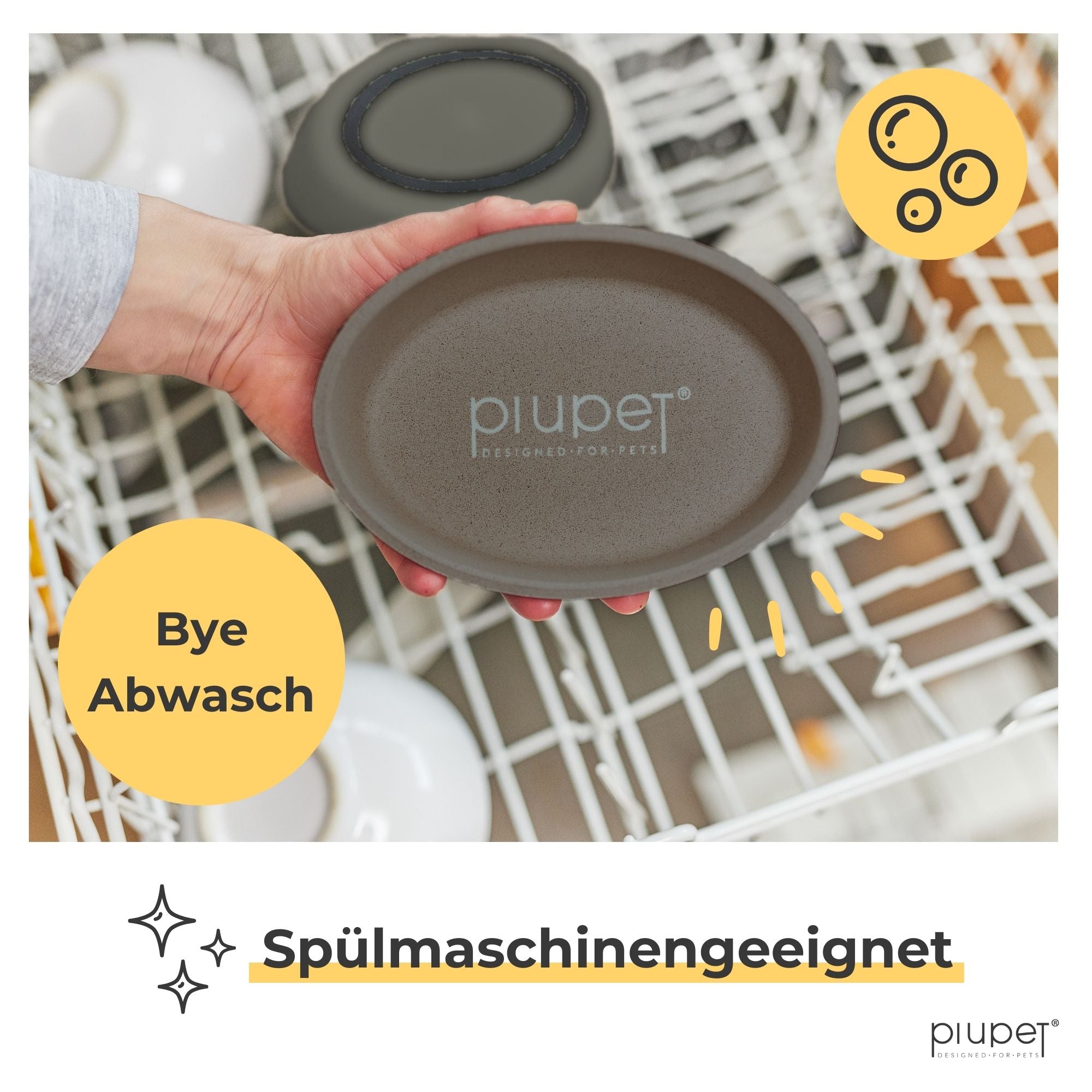 Graufarbener Katzennapf wird in die Spülmaschine gestellt – spülmaschinengeeignet und leicht zu reinigen