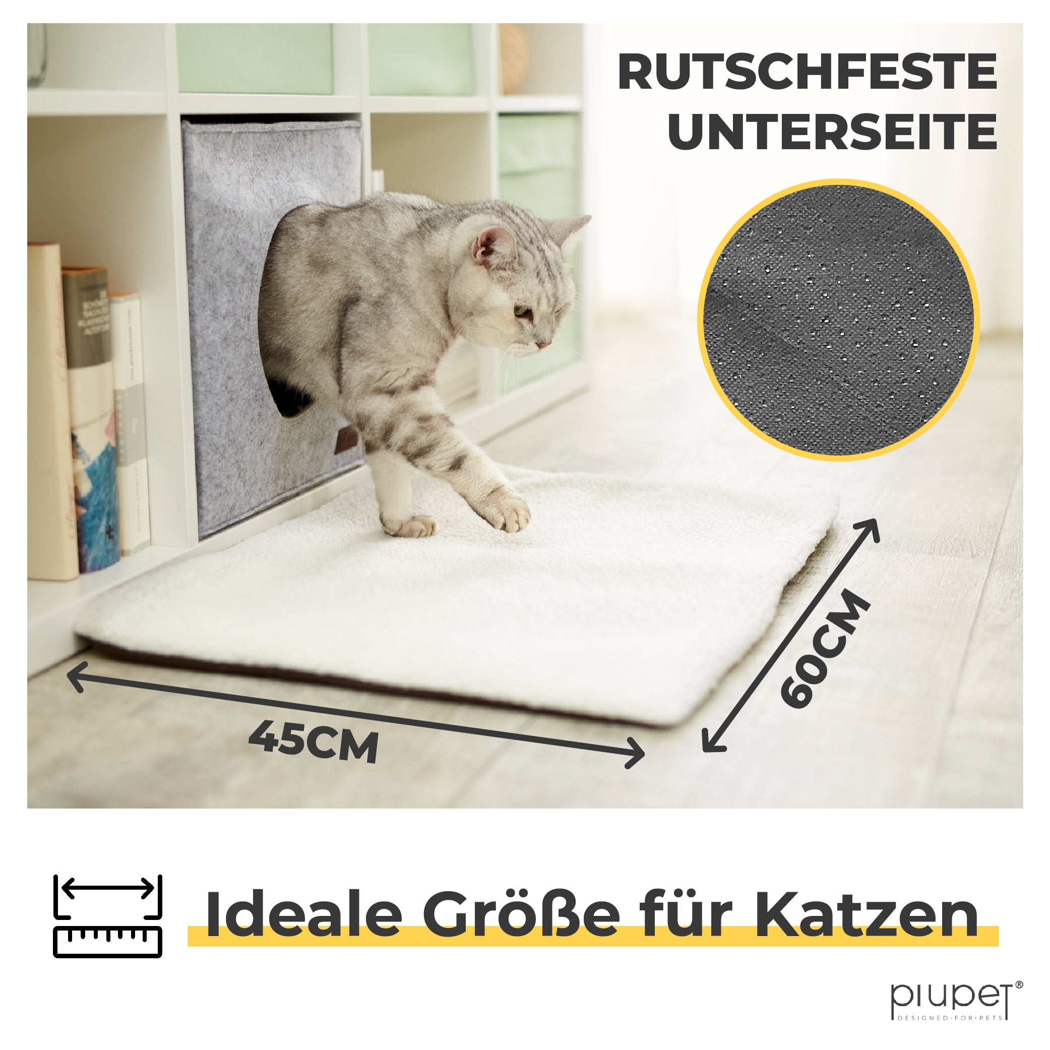 Katze steigt auf eine weiße Matte mit rutschfester Unterseite, Größe 45 × 60 cm.